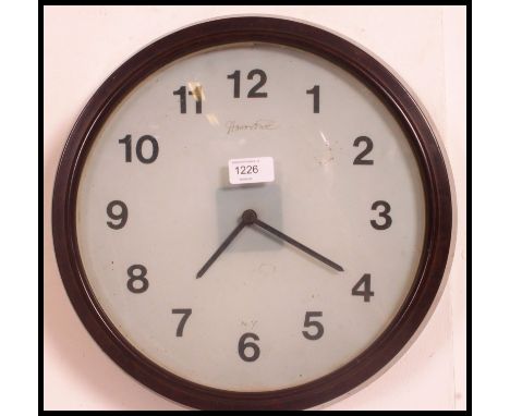 A vintage American bakelite vintage station - industrial factory clock. The dial marked for NY with illegible name atop havin