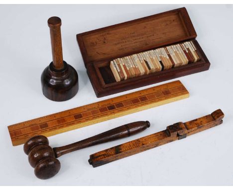 An early 20th century boxwood foot/shoe measure, having haniged brass mounted heel and toe stops, stamped Ullathorne &amp; Co