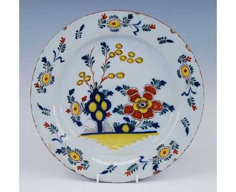 An English polychrome Delftware charger, possibly Richard Frank of Redcliff Back, Bristol, circa 1760, decorated with flowers