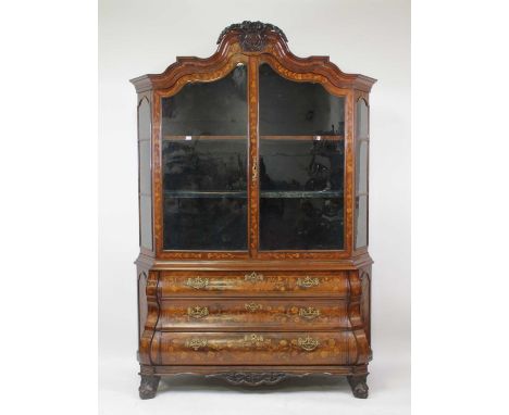 A late 19th century Dutch walnut and floral marquetry bookcase on chest, having a swept pediment with later inset oak ribbon 