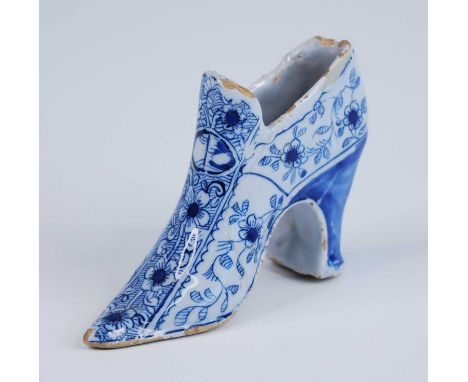 An English blue and white delftware shoe, probably London or Bristol, circa 1730, decorated with flowers, h.8cm Reference: Ar