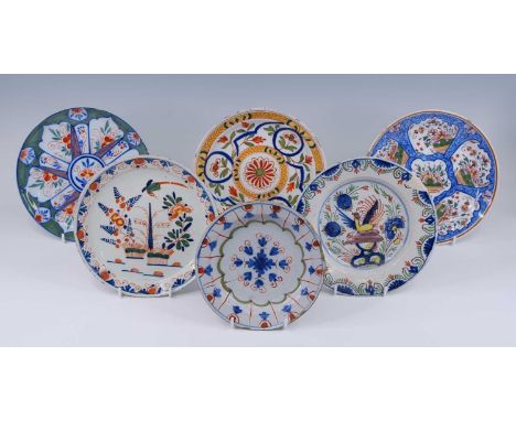 A collection of six Delft polychrome plates, 18th century and later, of varying patterns, largest dia.23.5cm (6) Reference: V