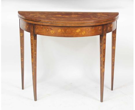 A circa 1800 mahogany and marquetry inlaid demi-lune card table, the fold-over top inlaid with a Roman chariot scene within a