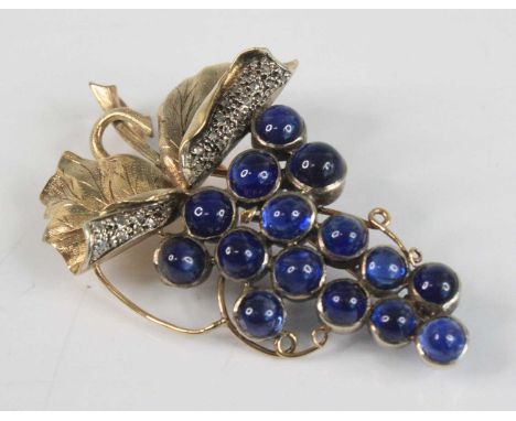 A yellow metal Art Nouveau style sapphire and diamond brooch in the form of a bunch of grapes, having 15 round cabochon cut s