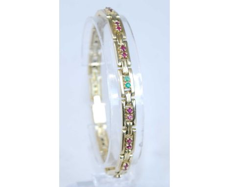 A yellow metal multi-stone articulated bar link bracelet, featuring six pairs of round sapphires alternating with six pairs o