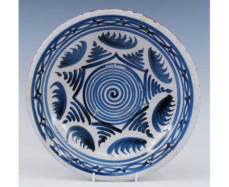 An English blue and white delftware dish, probably Brislington, circa 1670, decorated with geometric motifs, dia.32cm Referen