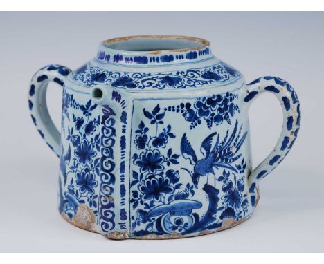 A Lambeth blue and white delftware posset pot, circa 1720, of cylindrical form, the spout flanked by twin handles, decorated 