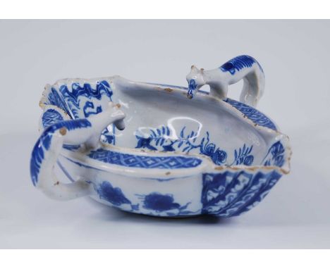 A Liverpool blue and white delftware double ended sauceboat, circa 1760, the press moulded body flanked by twin fox handles w