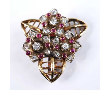 A yellow metal, ruby and diamond floral cluster brooch, featuring three flower motifs each with bold European cut diamonds an
