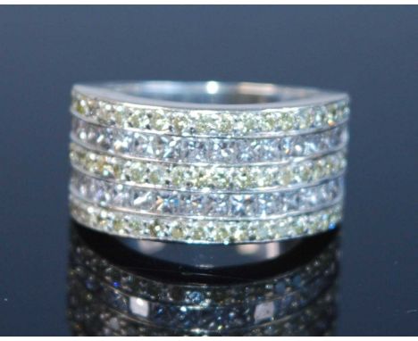 A white metal five-row diamond half hoop eternity ring, featuring two rows each with 16 princess cut diamonds alternating wit