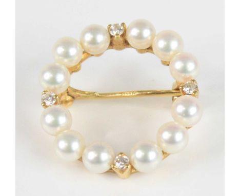 An 18ct yellow gold Mikimoto pearl and diamond circular brooch, comprising twelve 4.3mm Akoya cultured pearls and four round 