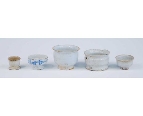 A collection of English delftware apothercary ointment dispensing pots, primarily Lambeth, 18th century, largest dia.7cm (5) 