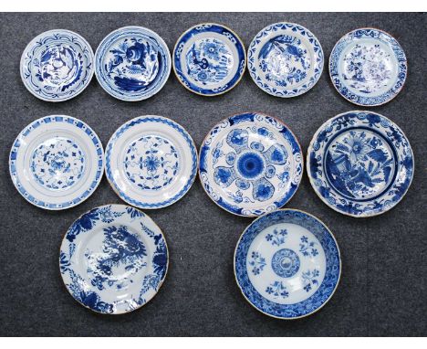 An English blue and white delftware dish, possibly Lambeth, 18th century, decorated with floral sprigs, dia.22.5cm, together 
