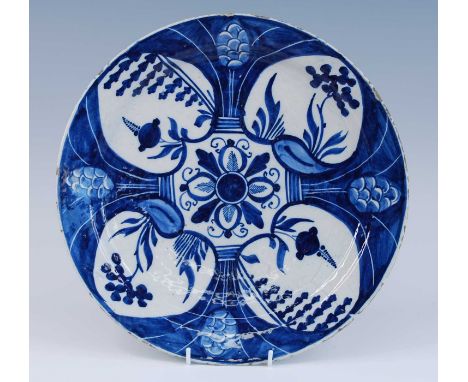 A Delft blue and white charger, 18th century, decorated with alternating heart motifs, possibly marked for Willem van der Koo
