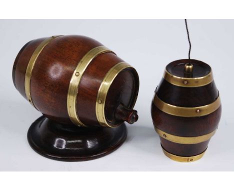 A 19th century treen cotton dispenser, in the form of a brass coopered walnut barrel with screw cap, the cutter in the form o