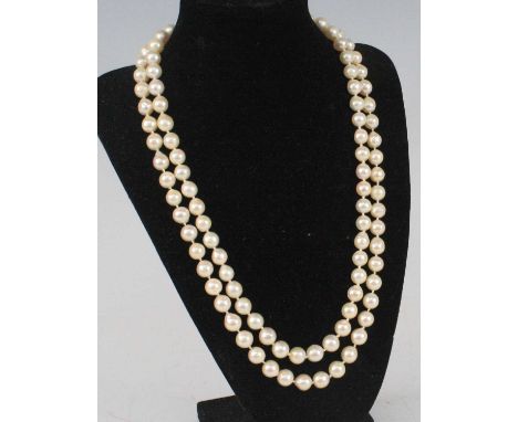 A two-row pearl necklace, featuring fifty-two and fifty-four 8.2 to 8.7mm baroque cultured pearls strung knotted to a 9ct yel
