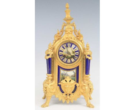 A late 19th century French gilt metal porcelain inset mantel clock (re-gilded), having a convex porcelain dial decorated with