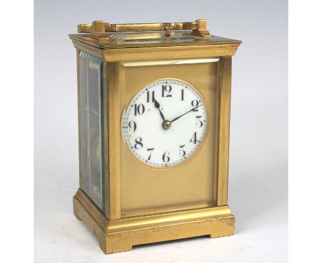 A circa 1900 French brass carriage clock, having an unsigned white enamel Arabic dial (hairline from centre), visible platfor