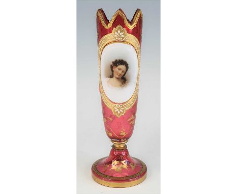 A Bohemian ruby glass vase, 19th century, decorated with a head and shoulders portrait of Cleopatra after Titian and heighten