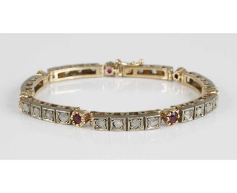 A yellow metal, ruby and diamond set tennis bracelet, arranged as seven four-section links each set with rose cut diamonds, e