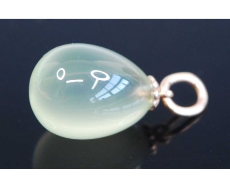 A Russian pale celadon jade pendant of pear shape, on yellow metal bale, stamped 56, maker's mark HW, 3.6g, height 18mm (excl