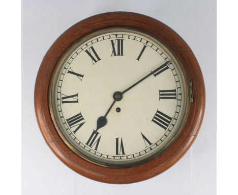 A Victorian oak cased wall clock, having a repainted circular white enamel 11" dial, single winding hole for an eight-day bra