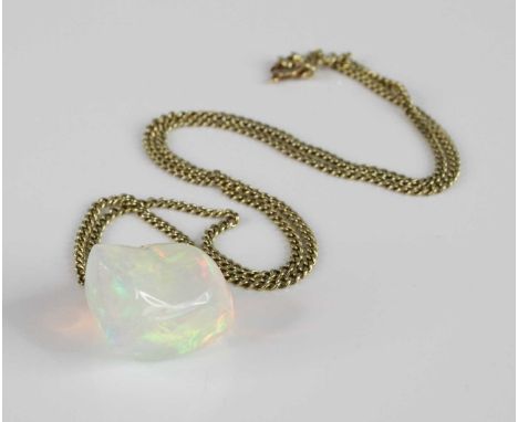 A polished opal pendant, of irregular slab-sided form, estimated weight approx 23 carats, w.20mm, h.22mm, on 14ct gold flat c