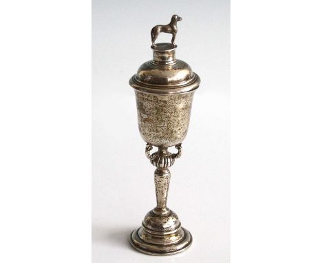 A George V silver Kennel Club miniature pedestal trophy cup and cover, the stepped and reeded cover surmounted with a cast do