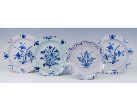 A pair of English blue and white delftware plates, probably Bristol, circa 1730, each decorated with flowers, dia.22.5cm, tog