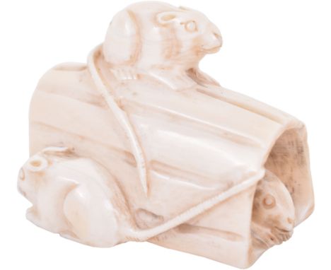 ^A 19th century Japanese carved ivory netsuke, Meiji period, signed, of a rat group on and in a log, 4.5cm