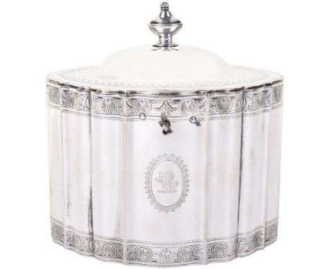 A superb George III silver tea caddy, Michael Plummer, London 1794, of fluted oval form with urn finial and shell decoration,