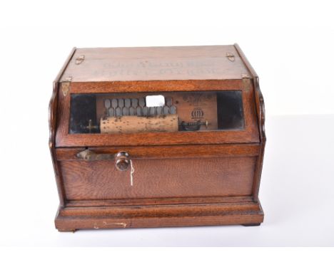 A ‘Chautauqua’ Concert roller organ, 20-note format, with cob view glazed slope panel, black stencilled polished oak case wit