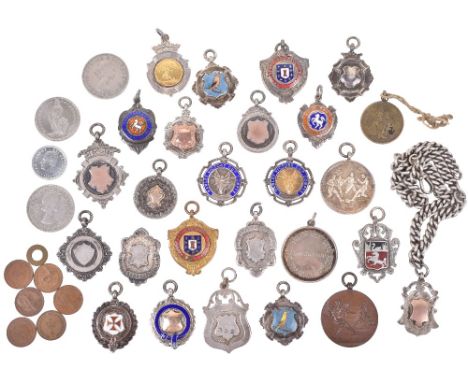 Twenty one silver, silver and gold and silver and enamel fob medals for sports, various hallmarks but all early to mid 20th c