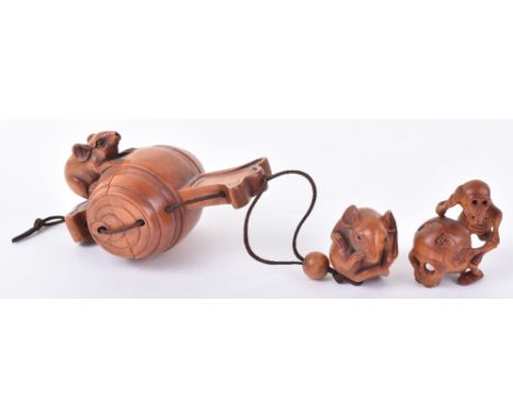 An early 20th century Japanese carved wood Inro and netsuke, of a mouse on a barrel over a balled mouse, signed, with another