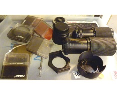 Tray of mixed camera lenses and accessories