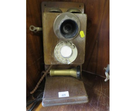 A VINTAGE WALL MOUNTED STICK TELEPHONE 