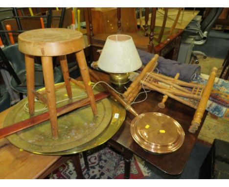 A woollen rug, a hanging tapestry, a brass top table, warming pan, lamp, stool, etc. 