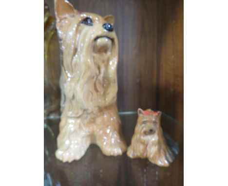 A BESWICK FIRESIDE MODEL OF A YORKSHIRE TERRIER TOGETHER WITH A SMALLER EXAMPLE 