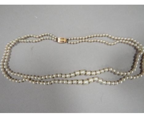 A VINTAGE SIMULATED PEARL DOUBLE STRAND NECKLACE WITH 9ct FASTENER BY CIRO 
