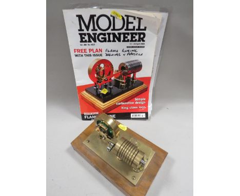 A FLAME / VACUUM ENGINE ON WOODEN PLINTH, with build plans 