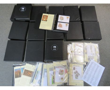 TWELVE ALBUMS OF STAMPS / FIRST DAY COVERS, world wildlife 1983 to 2003, together with a bag of loose sleeves of stamps 