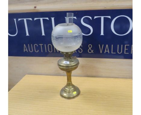 A VINTAGE BRASS OIL LAMP WITH SHADE 