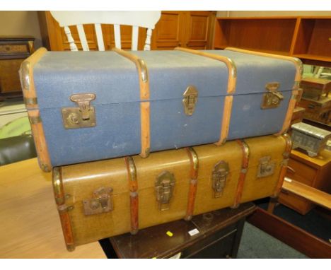 Two vintage banded packing trunks 