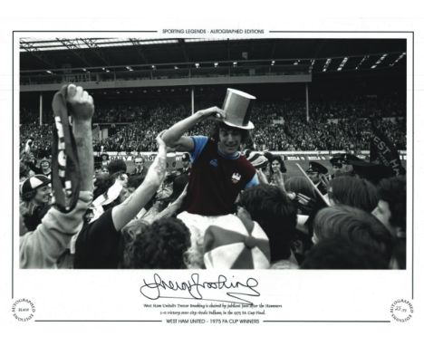 Trevor Brooking signed 16x12 inch colourised photo 'West Ham United  - 1975 FA Cup Winners' Chaired by Jubilant fans after th