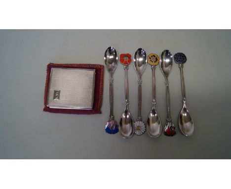 A Japanese engine turned .950 compact; together with a set of six teaspoons, with coloured enamel flower head terminals, mark