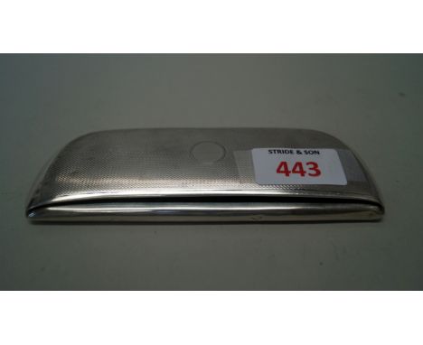 A silver engine turned spectacle case, Chester 1939, containing a pair of rimless spectacles.