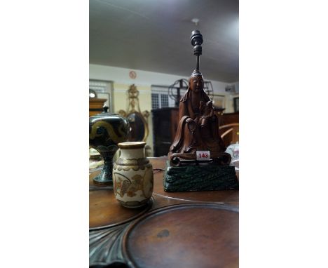 An Oriental carved wood figure group, 20cm high, now mounted on a pottery base with lamp fitting. Condition Report: Small woo