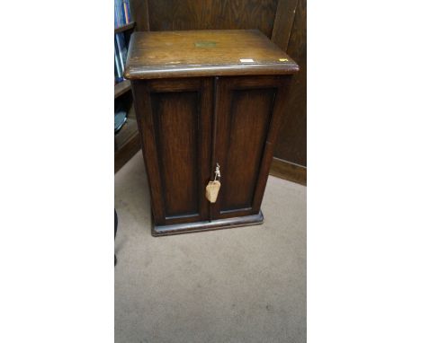 An Edwardian oak cased canteen of silver Old English pattern cutlery, by Walker & Hall, mostly Chester and Sheffield 1905/6, 