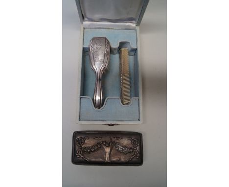 A silver mounted cut glass dressing table box; together with a child's metal hair brush and similar comb.