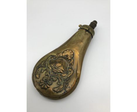 Antique brass ornate gun powder flask.